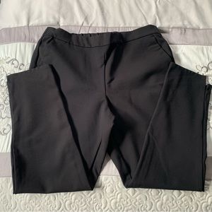 Comfortable black pants with pockets and double slit at ankle